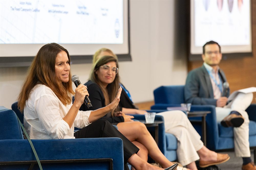 Leaders speaking on a panel at a Federation event